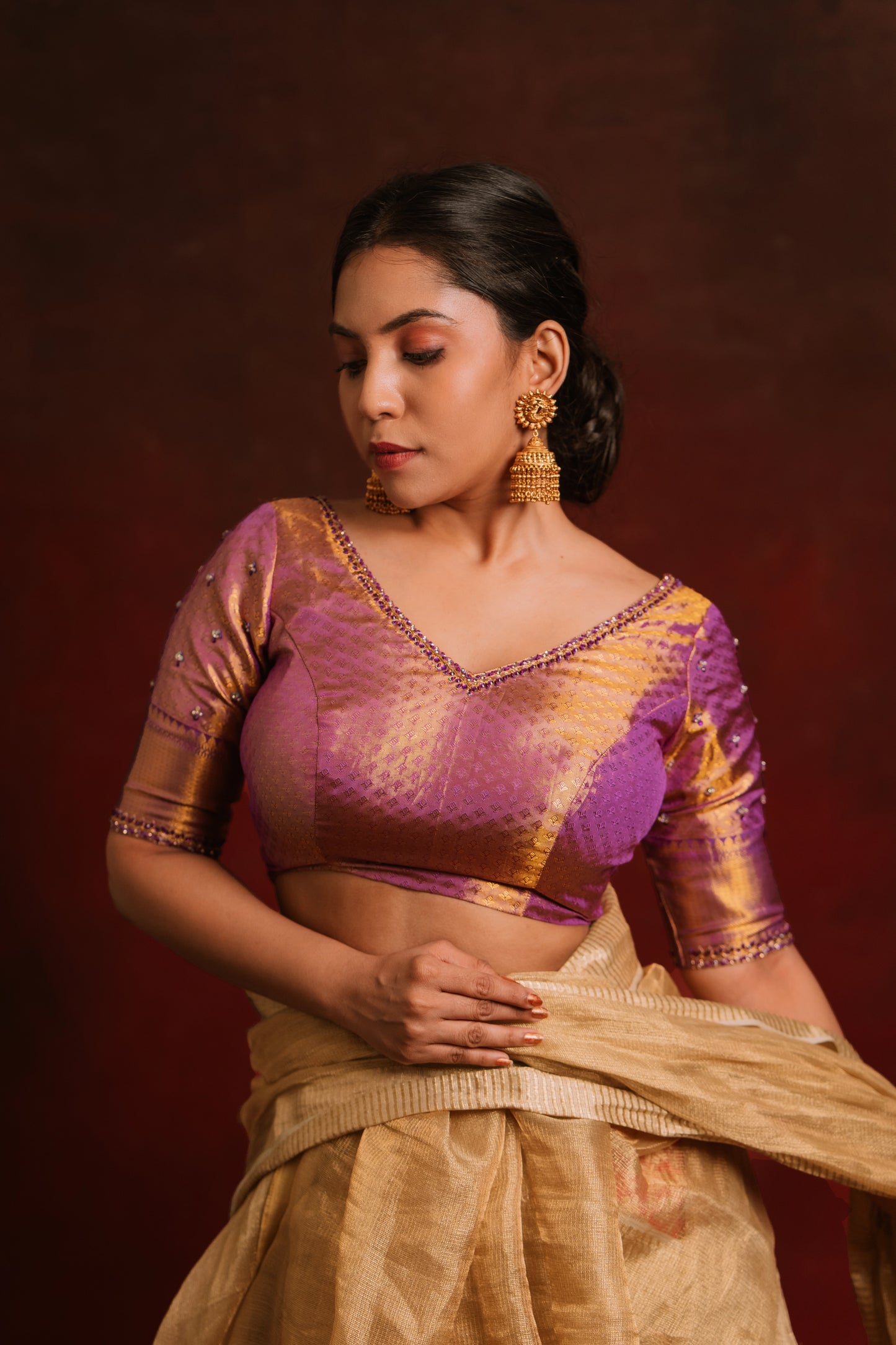 Model Dolly Aishwarya in a handcrafted kanjivaram tissue blouse in purple (Dual Tone Silk) by team AKloset. Fashionable, high-quality craftsmanship that is stylish and affordable.