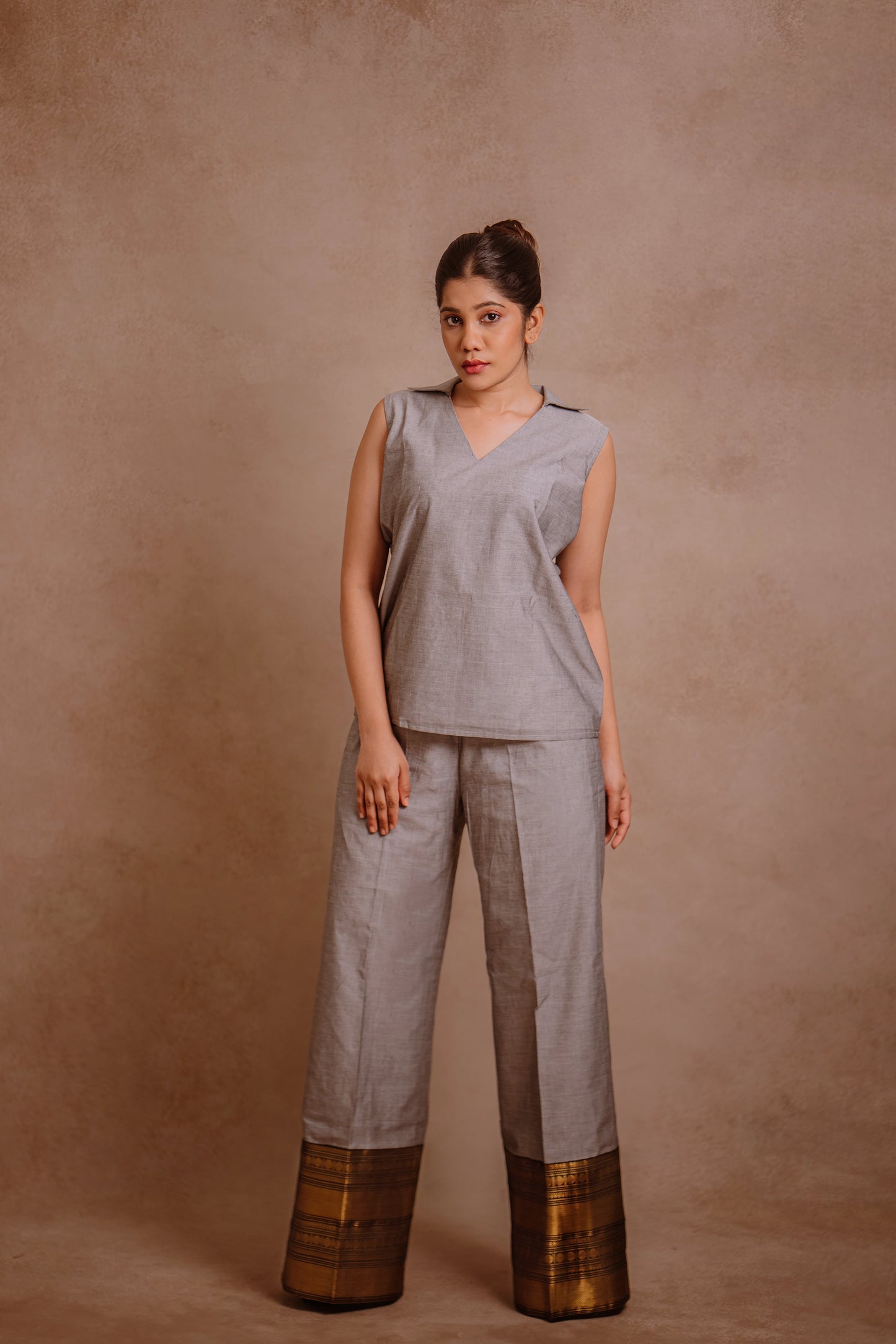 Model Jaina Parmar in a sleeveless co-ord set in gray by team AKloset.